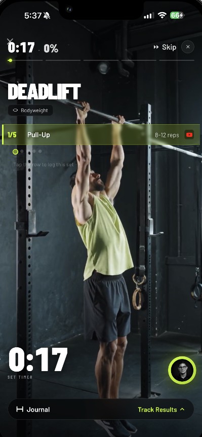 Forge mid-workout: a pull-up set with the form video playing and the set timer running